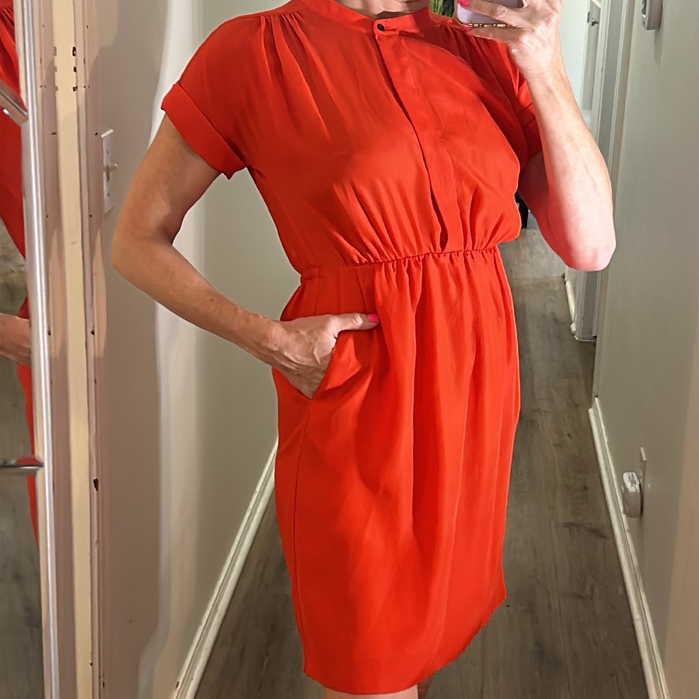 J Crew Orange short sleeve dress with two front pockets & hidden buttons on top
